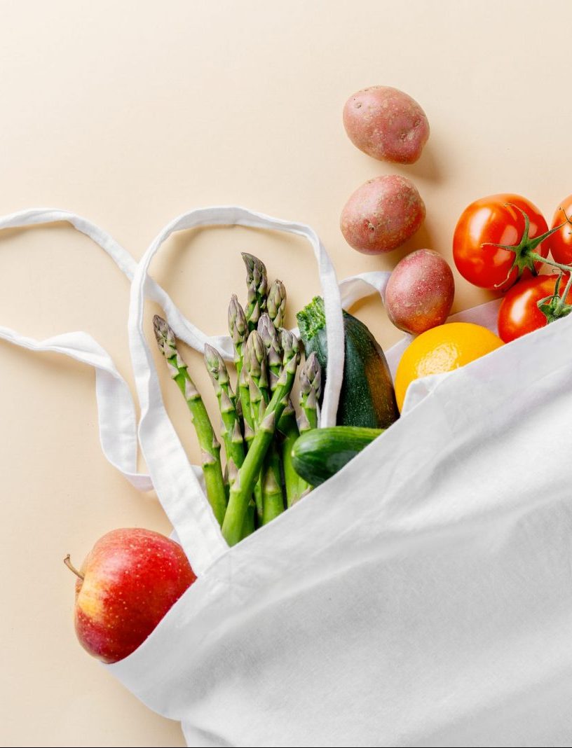 Zero waste concept. Vegetables in textile bag. No plastic. Bright Background. Clever consuming, healthy planet concept.